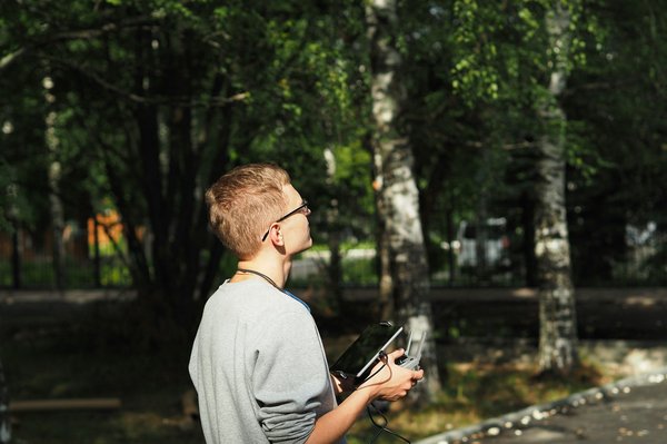 How to set up a UK-based drone photography business and comply with Civil Aviation Authority (CAA) regulations?